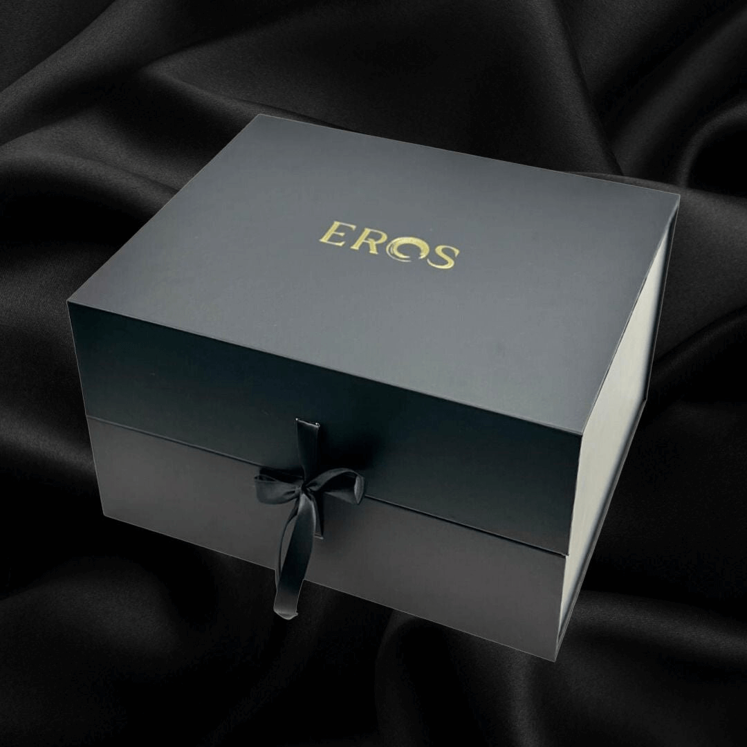 Elegant EROS gift box on black satin, featuring luxurious design for premium intimate products.
